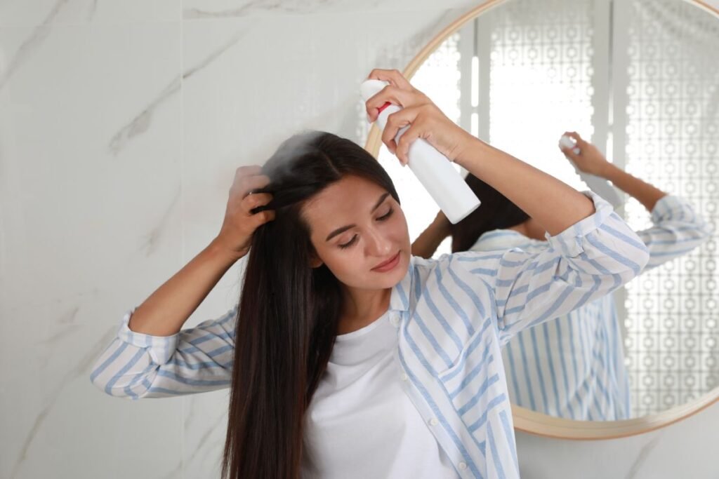 Woman Applying Dry Shampoo