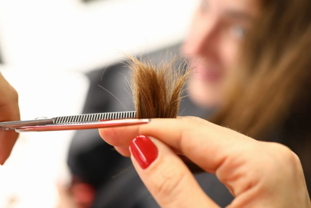Woman Cutting Split Ends of Hair