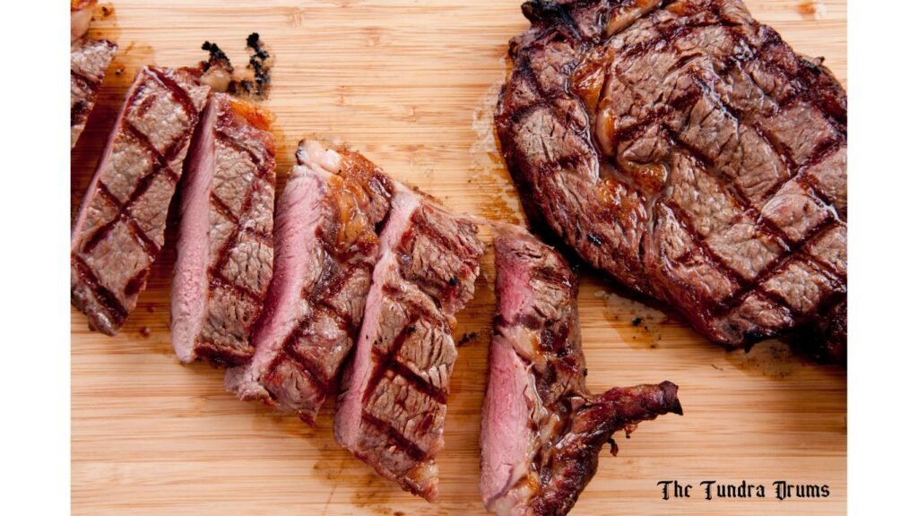 Nicely sliced steak served on a platter 