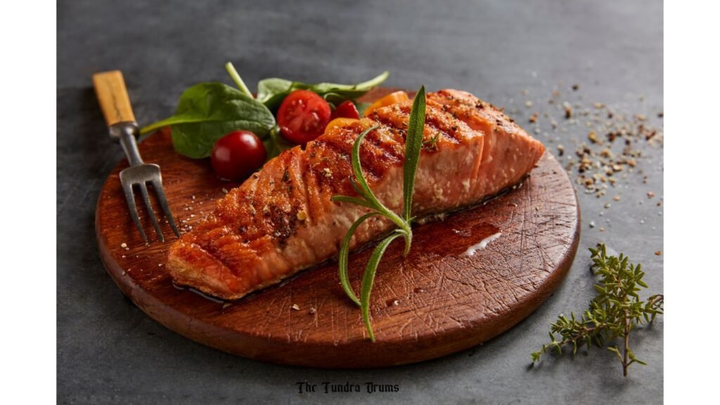 Freshly fried Salmon placed on a wooden platter