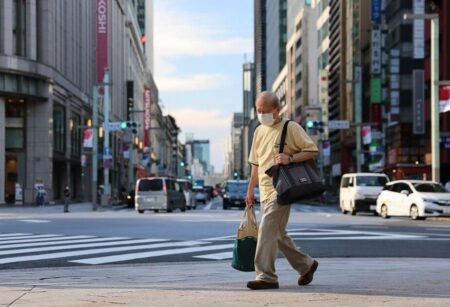 A Japanese man walking on the street