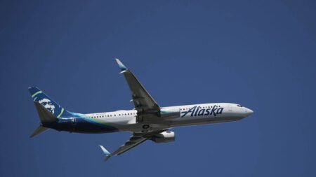 An Alaska Airlines aircraft was forced to return to Seattle An Alaska Airlines Boeing airplane flying in the sky.