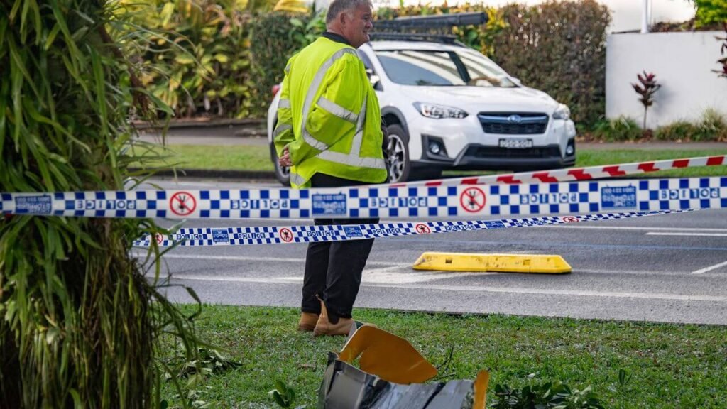 Wreckage on ground after a helicopter crashed into a hotel rooftop in Australia