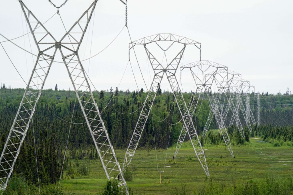 Power line towers stretching across a landscape in Alaska