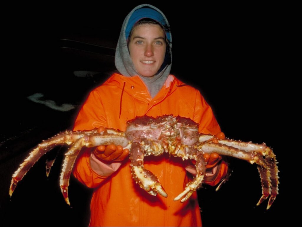 A person holding an Alaskan snow crab