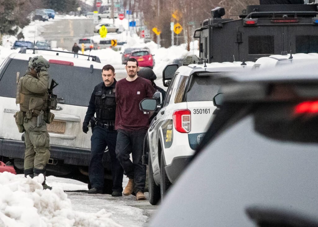 Alaska standoff suspect Brendalee Merritt faces charges.