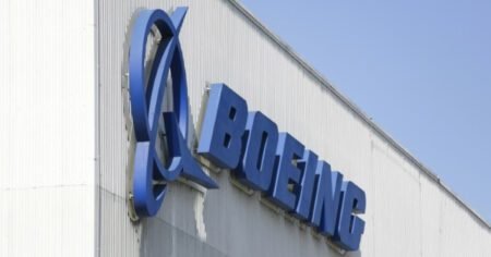 Boeing logo is prominently displayed on the side of a building.