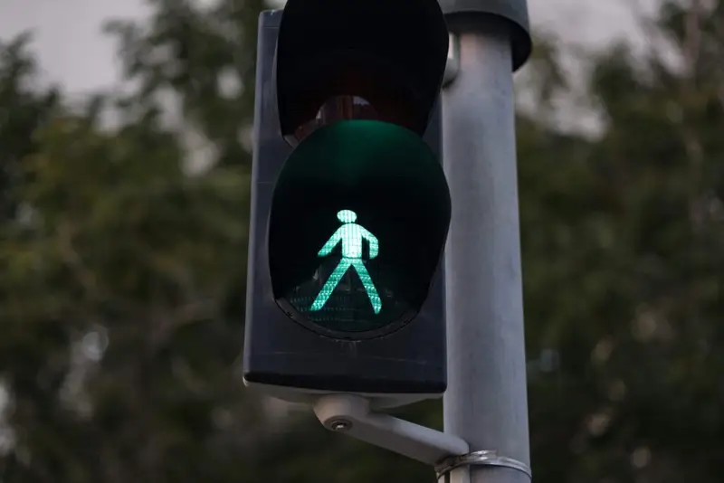 A green pedestrian signal