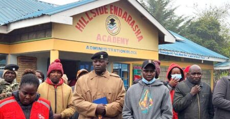 Kenya School Fire Tragedy Claims 17 Lives and Injures 14 at Hillside Endarasha Academy People standing outside the Hillside Endarasha Primary school