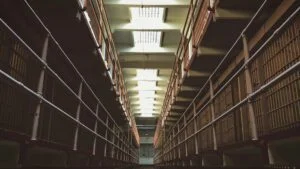 A long, narrow corridor inside a prison