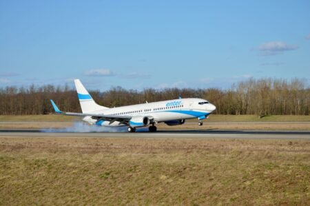 A cargo plane taking off from the runway.