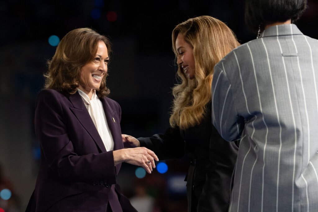 Beyonce and Kamala Harris shaking hands.