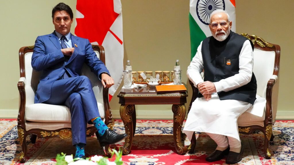 Indian Prime Minister Narendra Modi and Canadian Prime Minister Justin Trudeau sitting together.