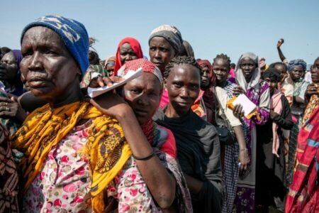People of Sudan standing together.