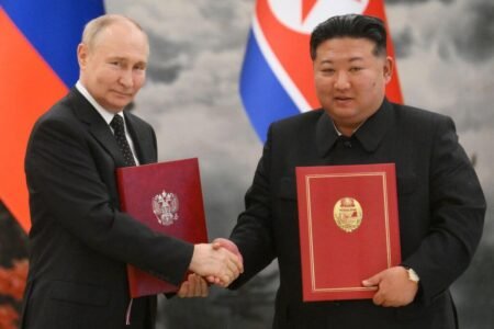 Concerns Grow Over North Korean Troops in Russia Amid Ukraine Conflict North Korean President Kim Jong Un and Russian President Putin shaking hands