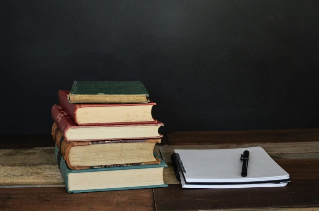 A stack of books on a table.