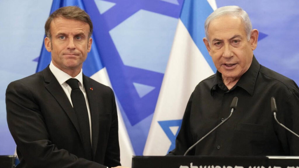 Israeli Prime Minister Benjamin Netanyahu and French President Emmanuel Macron shaking hands