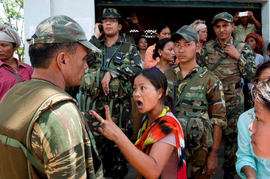 A woman gestures as she argues with Indian army in Manipur