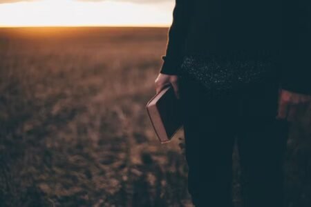 book reading in flower field