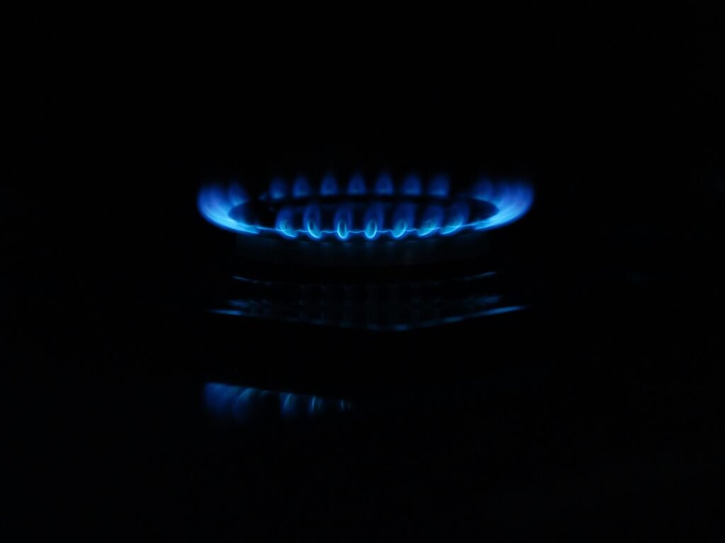 A gas stove with blue flames.