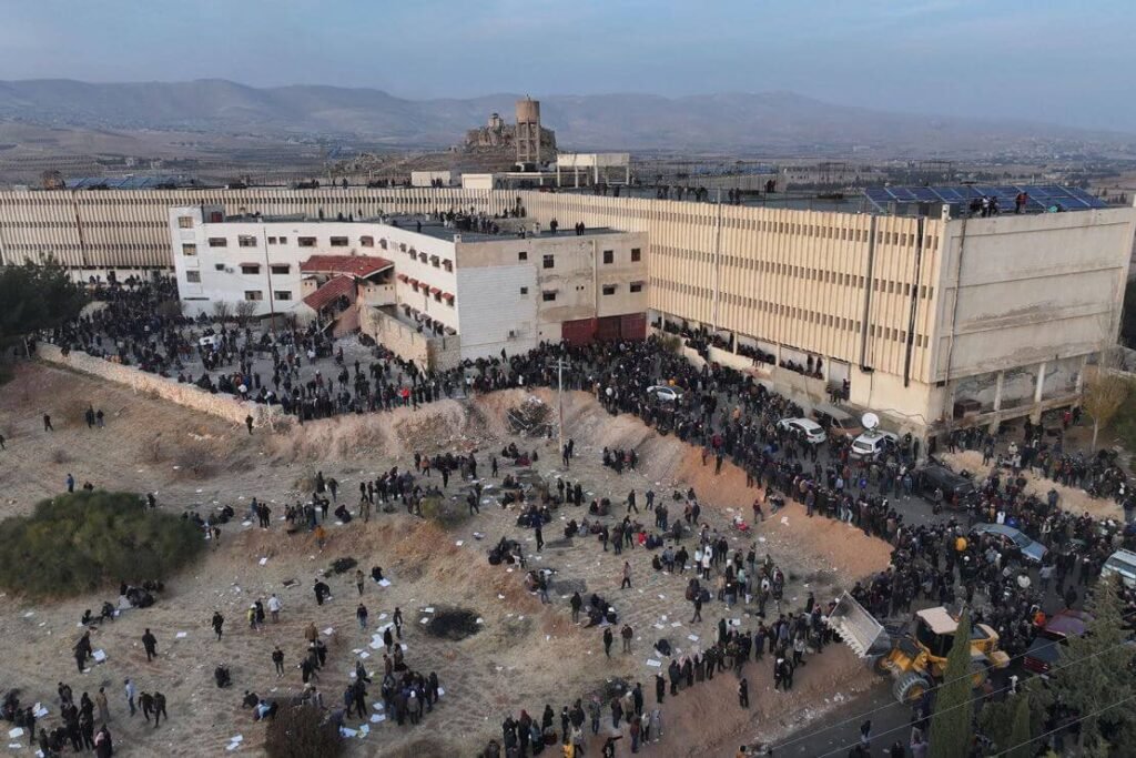 People gather at the Saydnaya prison near Damascus, Syria.