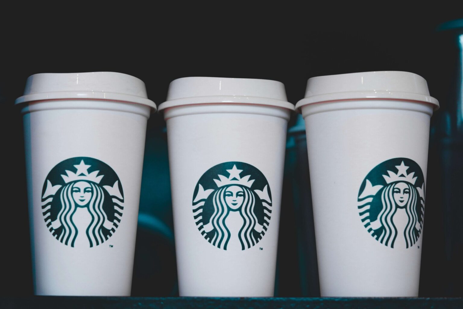 Starbucks Workers Plans Nationwide Strikes Over Stalled Union Negotiations Three Starbucks cups on a table.