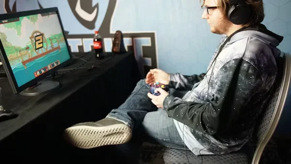 a man playing video game on laptop 1 1
