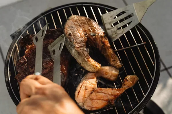 Where Is the Best Hibachi Restaurant? A person is grilling meat on a grill
