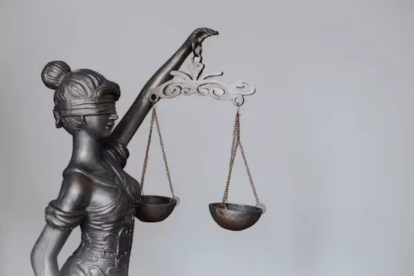 Wrongful Death Settlements: All the Losses and Damages that are Included A statue holding scale of justice