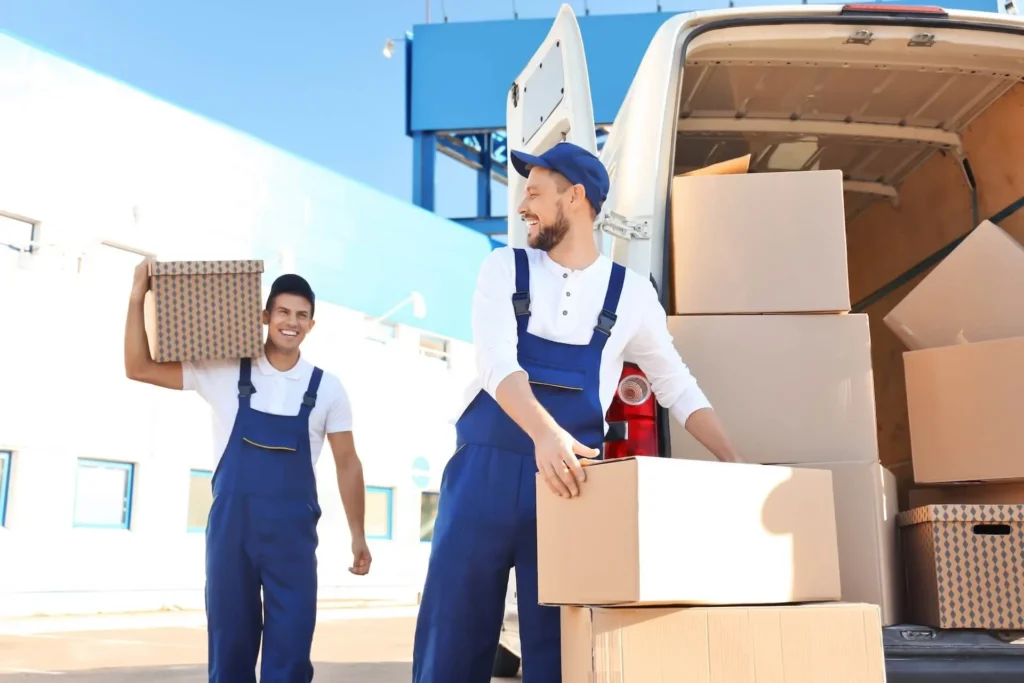 Moving to Alaska Made Simple with Local Insights and Practical Tips Two men holding boxes