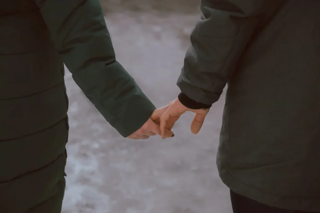 two person holding hands