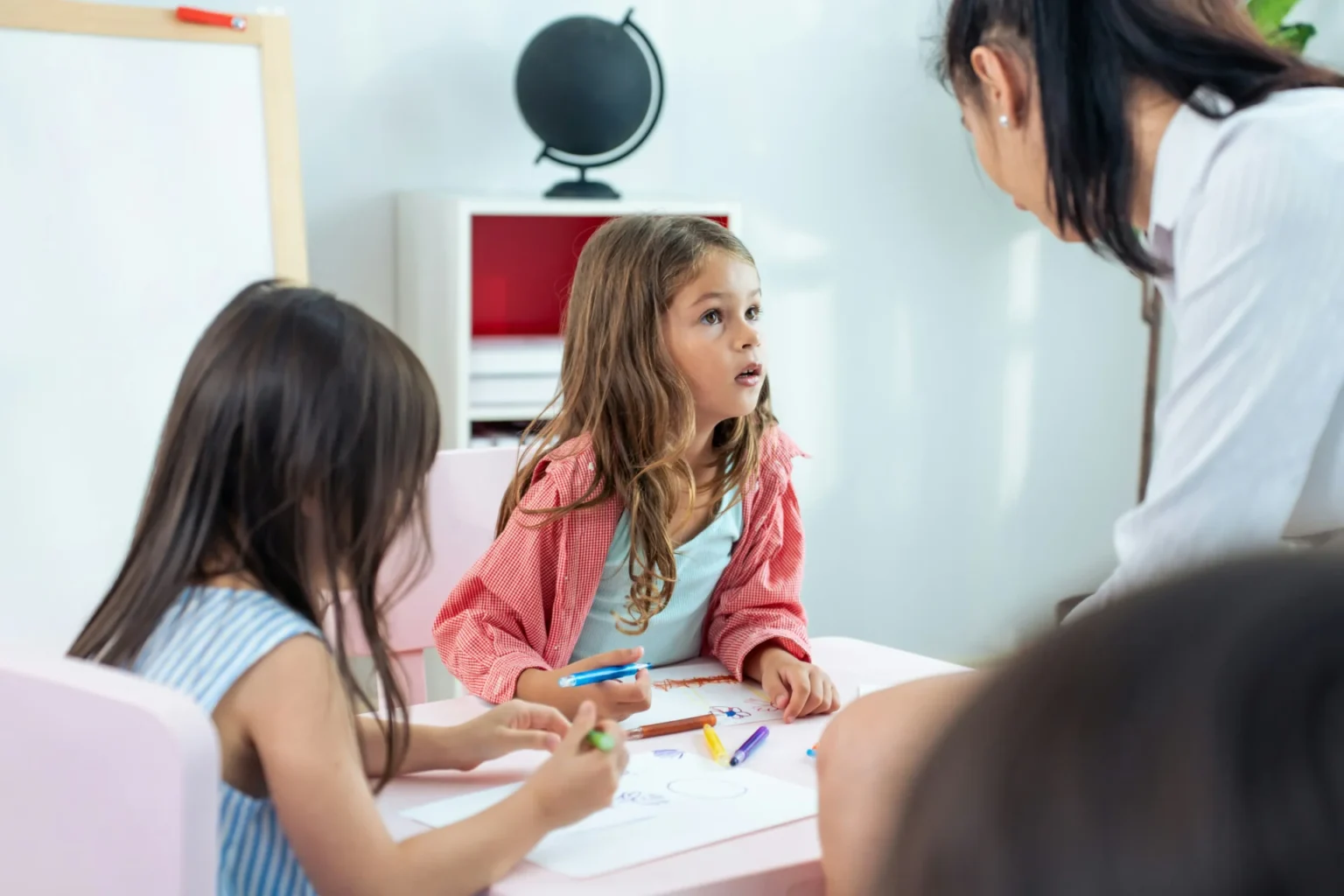 A teacher is teaching her students.