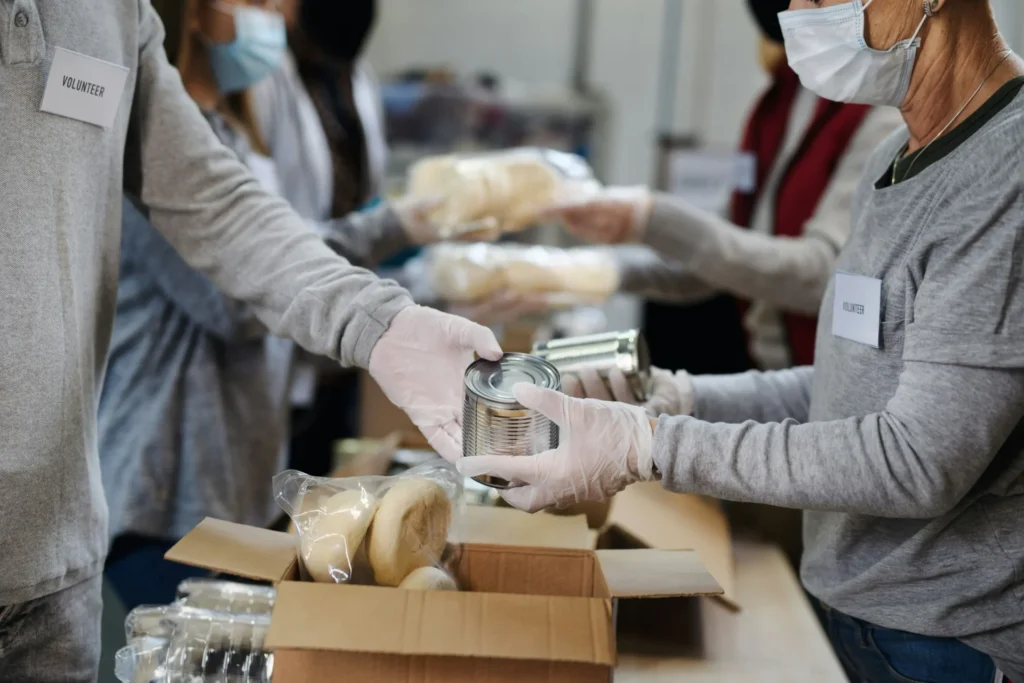 A group volunteers working at a charity center.