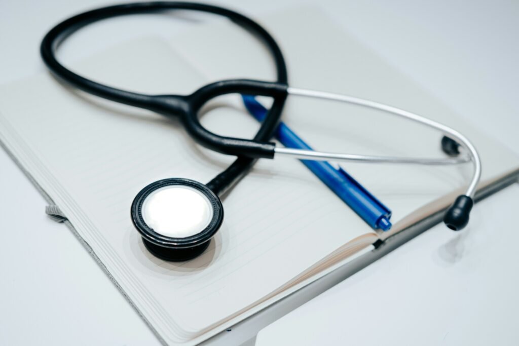 A Stethoscope is laid on top of a file.