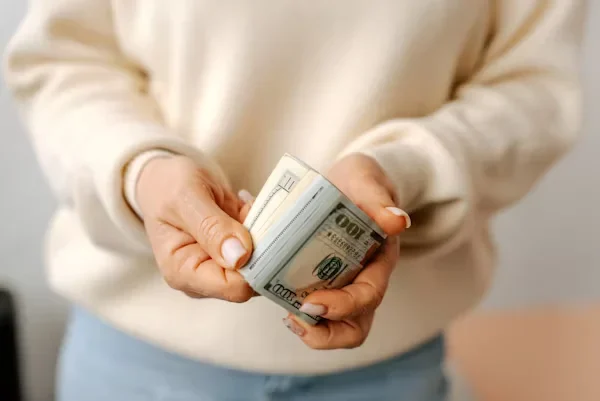 woman holding alot of money 1
