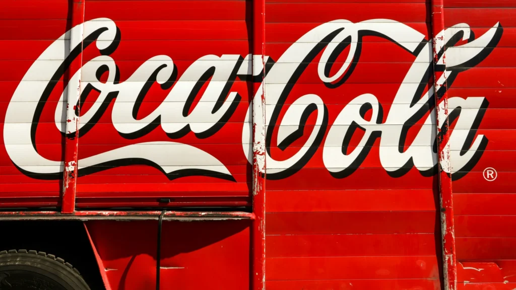 Coca-Cola written on a trailer.