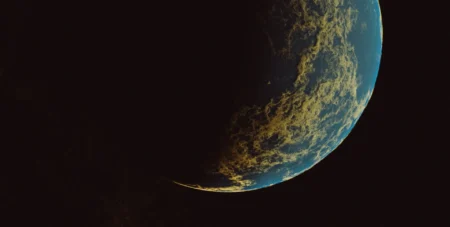 A view of Earth partially hidden in the dark.