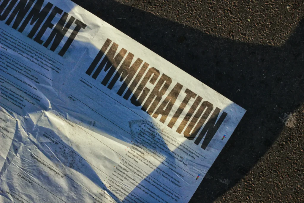 A white crumpled paper with immigration written on it.