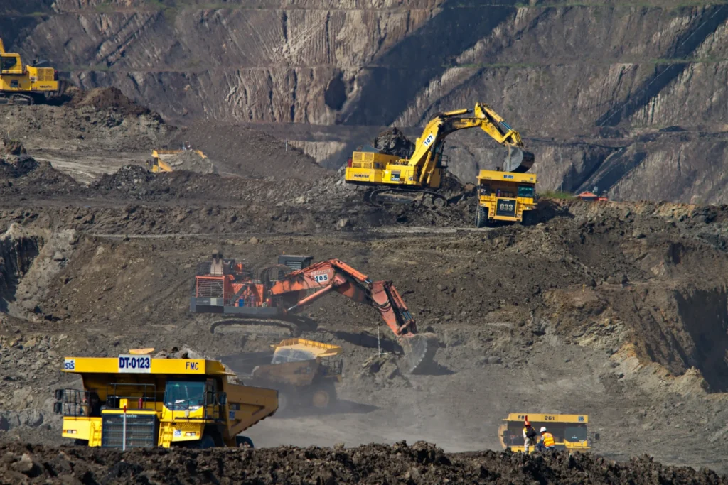 Multiple excavators at a mining area.