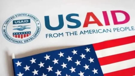USAID Staff Placed on Leave as Trump’s Administration Cuts Foreign Aid USAID logo with an American flag.