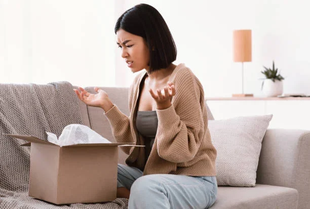The Three Types of Product Liability Claims You Should Know About a girl looking angry sitting on couch