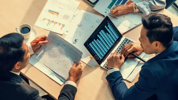 Risk Management and Compliance: How CPAs Safeguard Your Business a group of employees sitting next to each other.