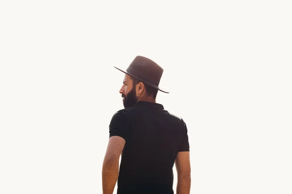 Top Reasons Every Man Needs a Gambler Hat a man in black shirt and brown hat