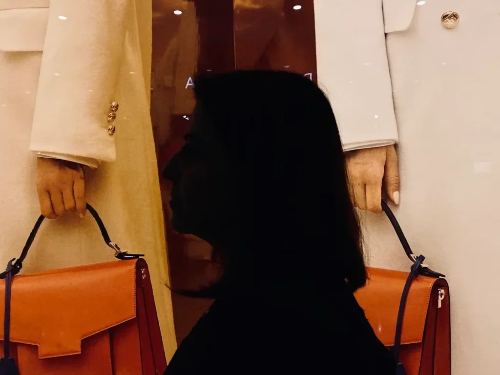 a woman holding bags in her hands