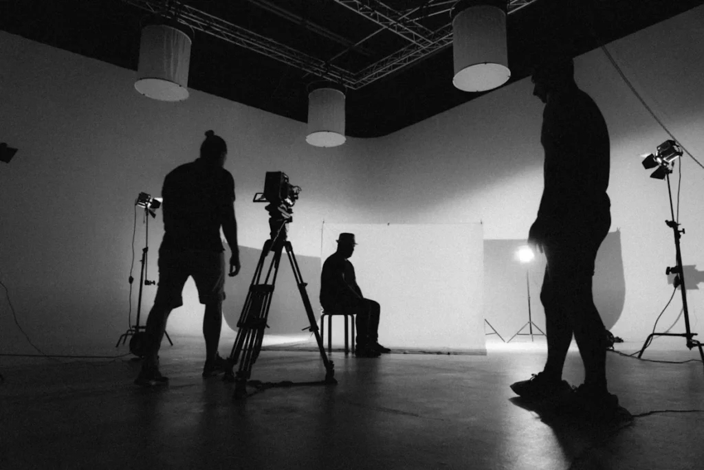 Proven Tips for Getting Noticed by a Casting Agency A black and white photo of a man standing in front of camera