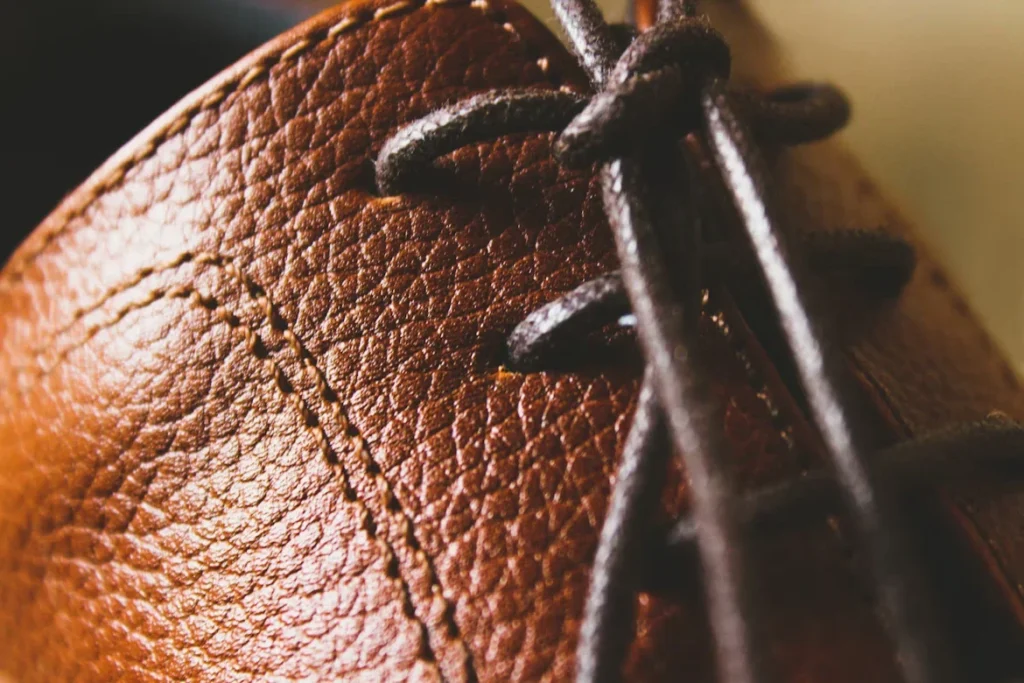 10 Expert Tips for Buying Durable Men's Leather Sandals A close up shot of a brown leather shoe