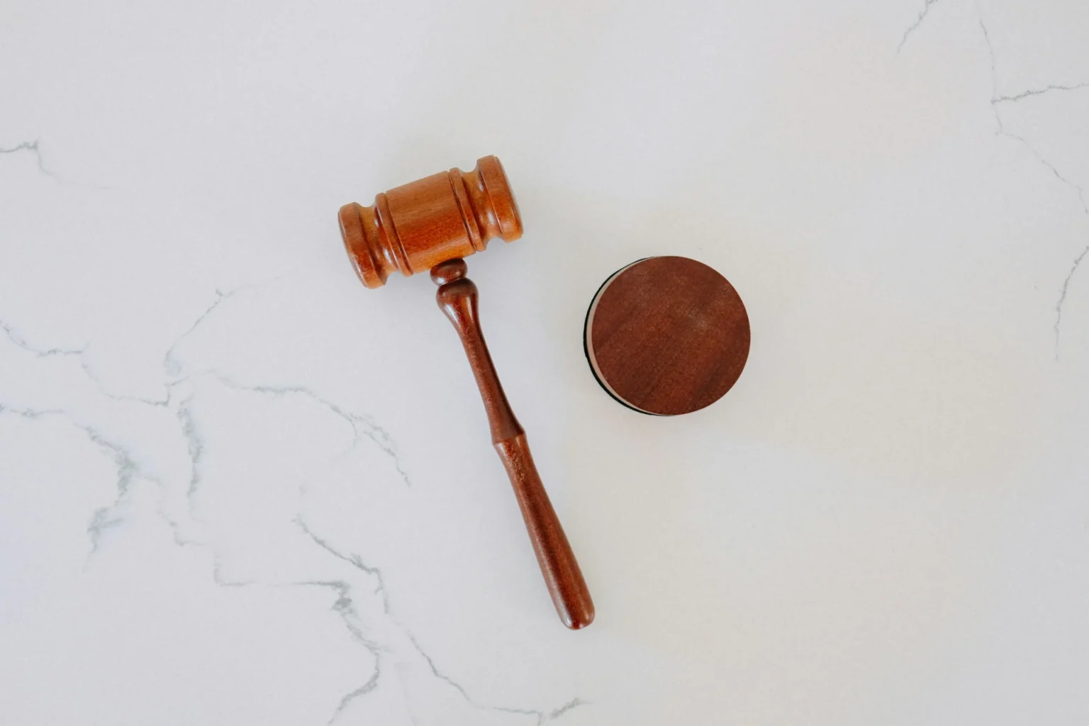 Alaska Supreme Court Implements New Limits on Trial Delays A wooden gavel laying on a table.