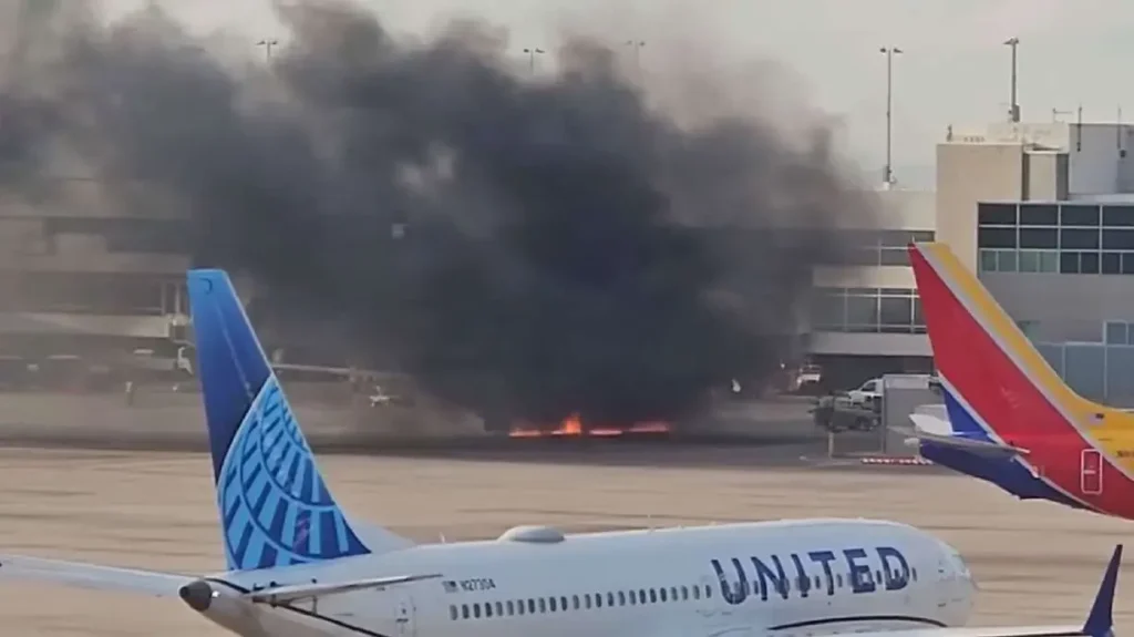 Smoke coming out of an American Airline Plane.