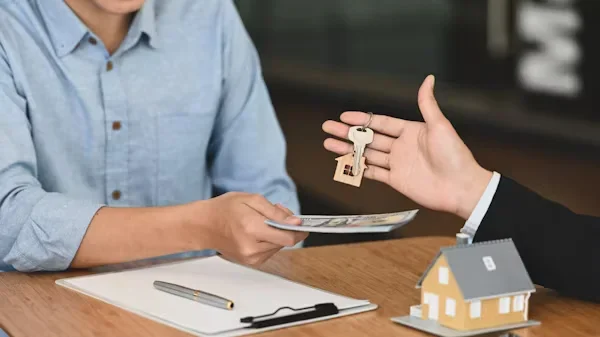 How to Buy the Right Retirement Homes for Sale a person holding keys in his hand