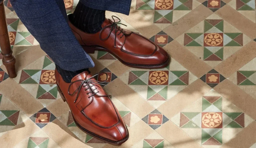10 Expert Tips for Buying Durable Men's Leather Sandals a person wearing brown leather shoes